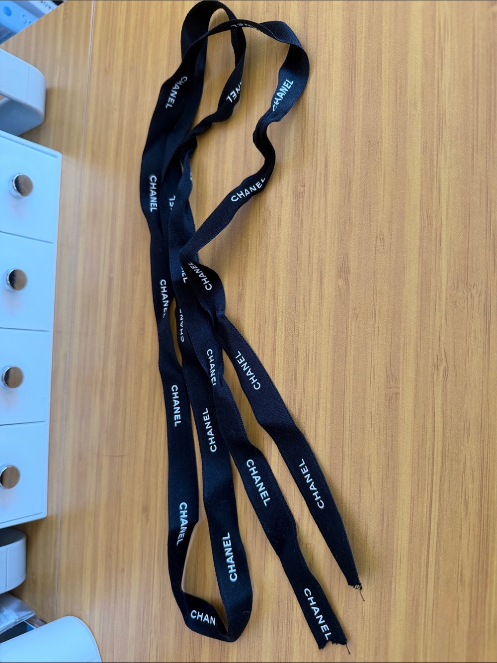 CHANEL Black Ribbon with White Logo Text